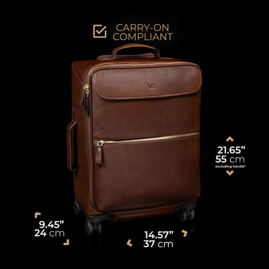 Brown leather suitcase with dimensions and 'carry-on compliant' label on a black background