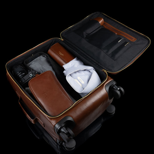 Von Baer Voyager luxury brown leather carry-on trolley bag for travel showing inner space packed with clothes