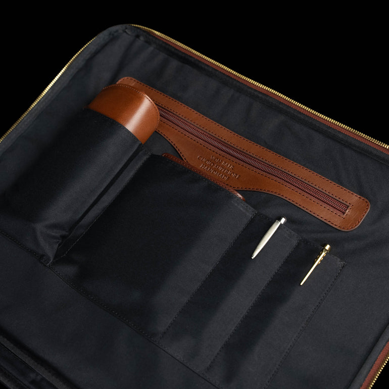 Von Baer Voyager luxury brown leather carry-on trolley bag for travel showing pockets and essentials