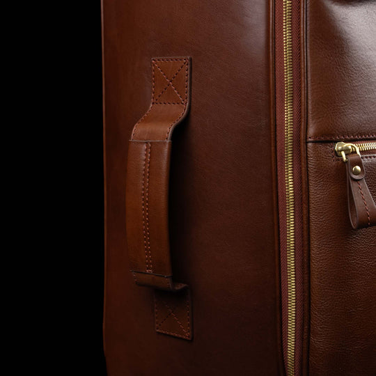 Von Baer Voyager luxury brown leather carry-on trolley bag for travel showing side handle