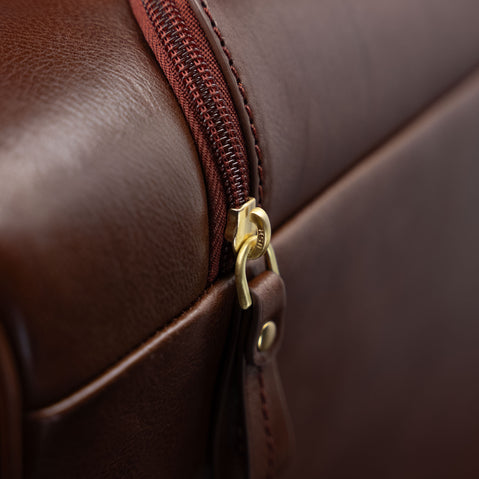 Von Baer Voyager luxury leather carry-on trolley bag for travel close-up of zipped pocket for handle