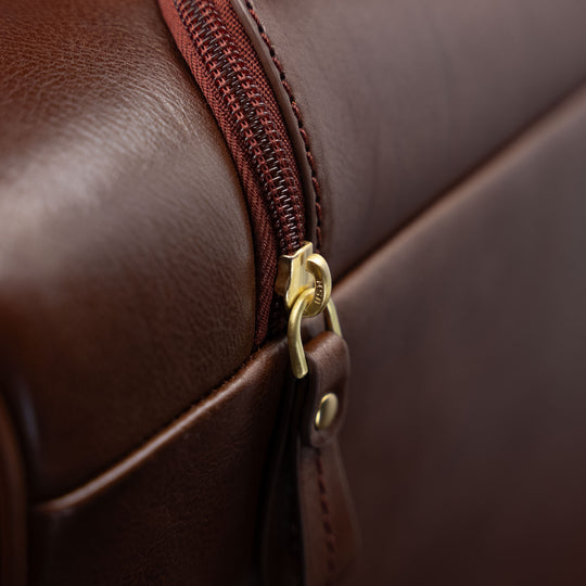 Von Baer Voyager luxury leather carry-on trolley bag for travel close-up of zipped pocket for handle