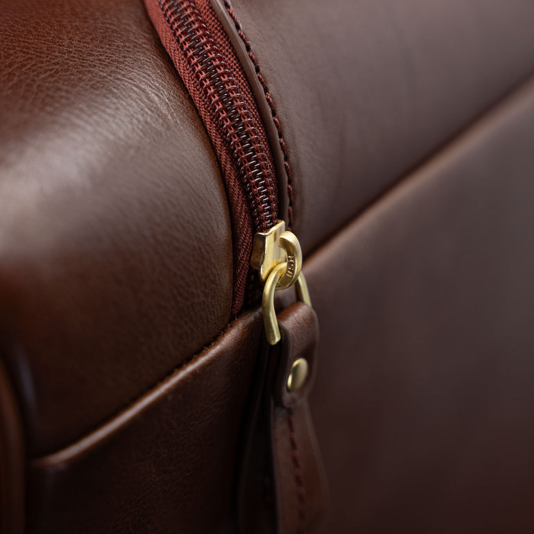 Von Baer Voyager luxury leather carry-on trolley bag for travel close-up of zipped pocket for handle