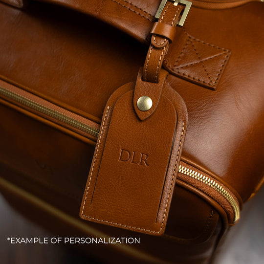 Von Baer Voyager luxury tan leather carry-on trolley bag with personalized embossed initials on luggage tag DLR