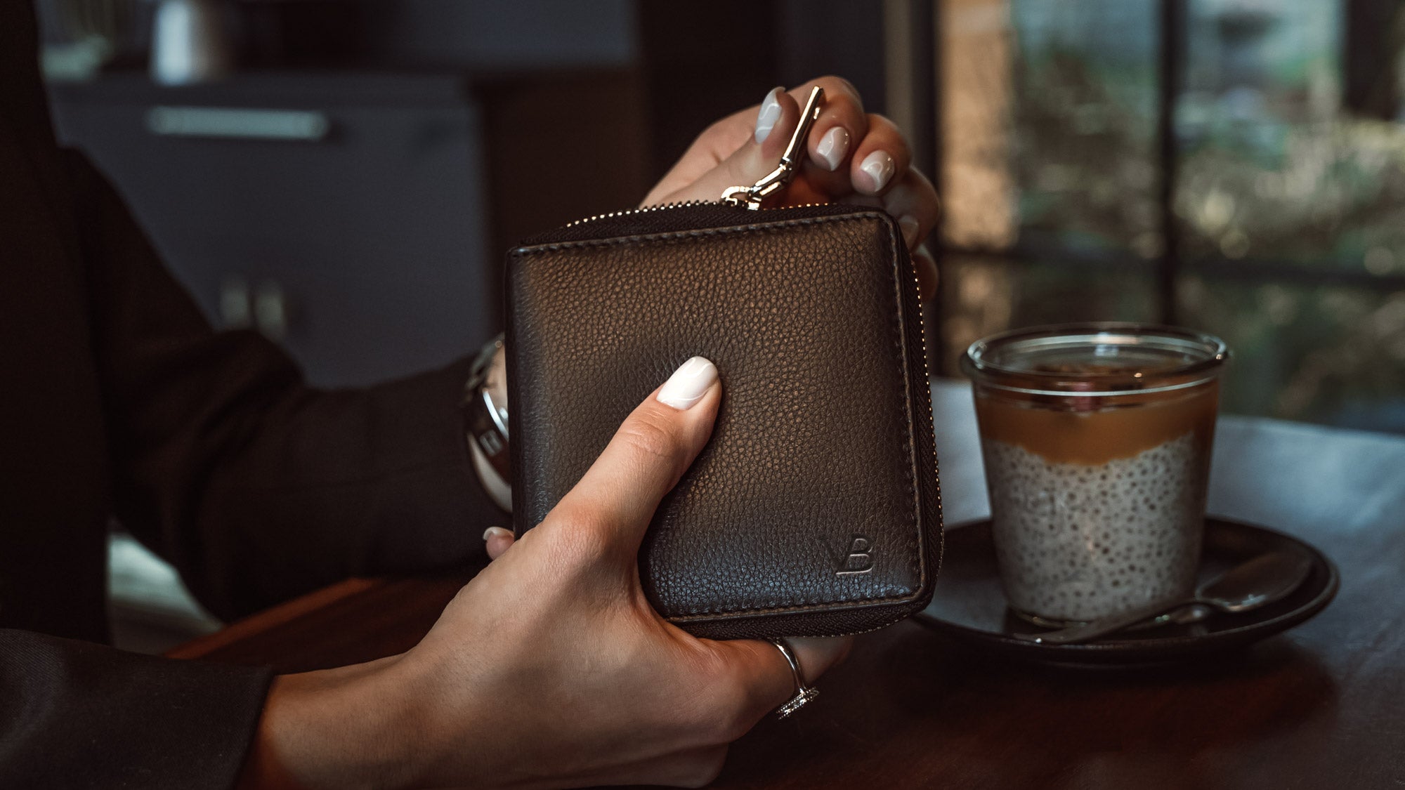 Von Baer W3 luxurious leather women's purse wallet in brown, featuring the Von Baer logo, showcased in a lifestyle slider image.