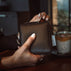 Von Baer W3 luxurious leather women's purse wallet in brown, featuring the Von Baer logo, displayed in a lifestyle setting.