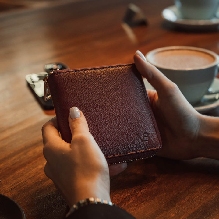 Von Baer W3 luxurious leather purse wallet for women in red, featuring the VB logo and money, presented in a lifestyle context.