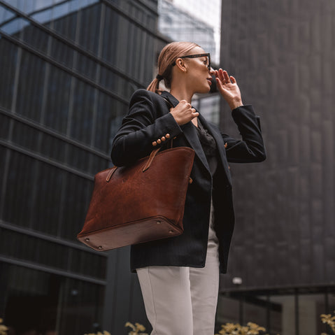 von baer womens elegance large leather tote bag brown with female model in business quarter