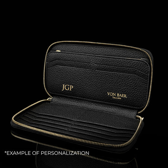 Von Baer origin luxury large men’s leather wallet with personalized embossed initials, example of customization.
