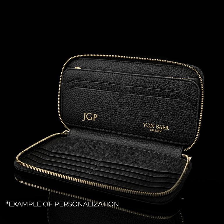 Von Baer origin luxury large men’s leather wallet with personalized embossed initials, example of customization.