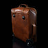 voyager leather carry on bag with wheels solid brown back front view for women