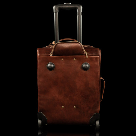 voyager leather carry on bag with wheels solid brown back view with wheels drawer out